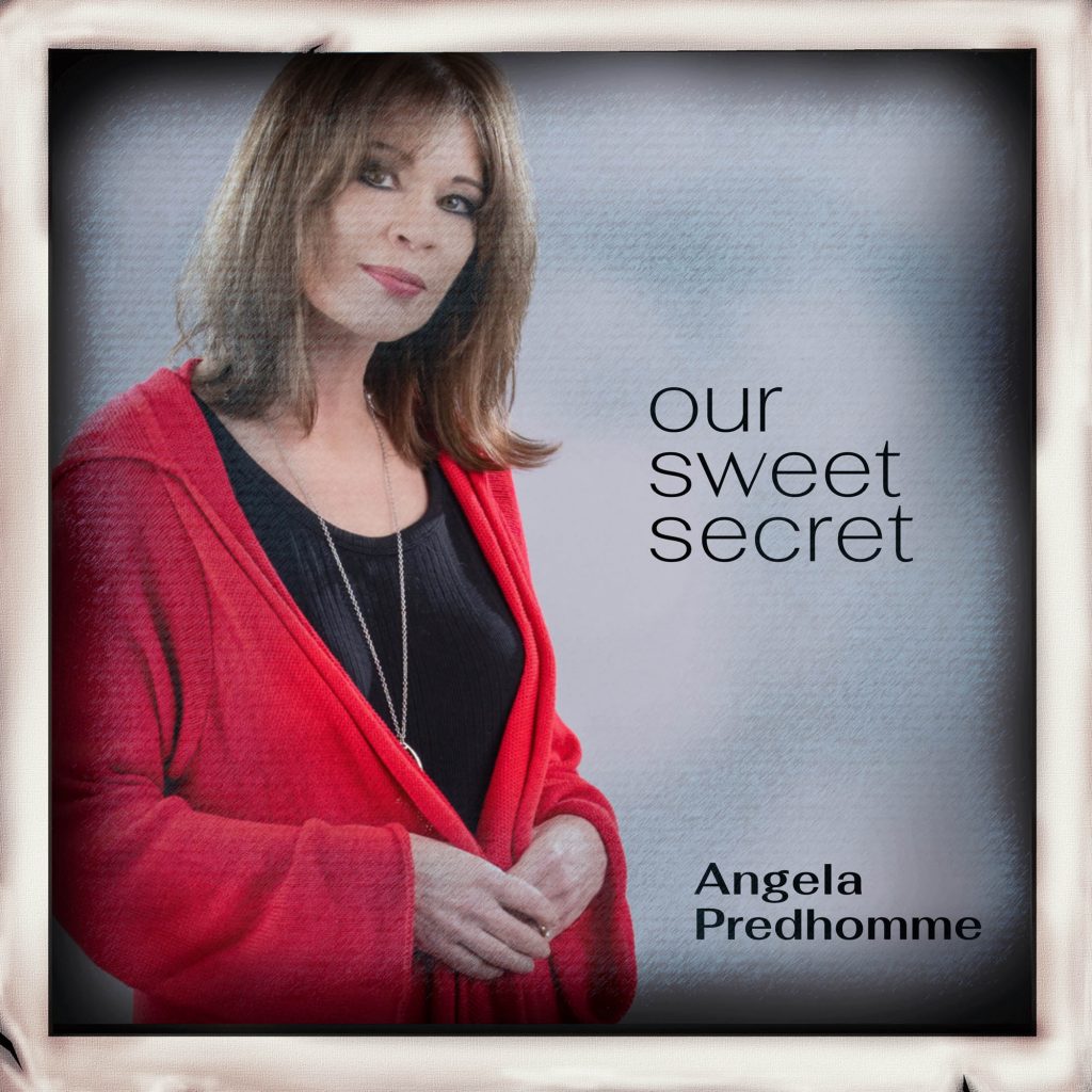 Woman with red sweater on looking at camera with hands clasped in front